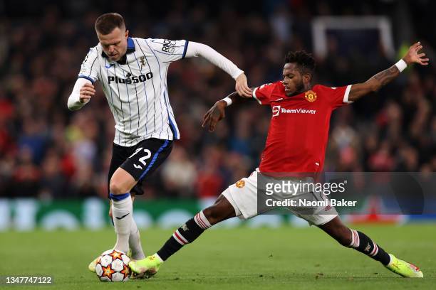 Josip Ilicic of Atalanta is challenged by Fred of Manchester United during the UEFA Champions League group F match between Manchester United and...