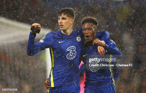 Kai Havertz of Chelsea celebrates with teammate Callum Hudson-Odoi after scoring their team's third goal during the UEFA Champions League group H...