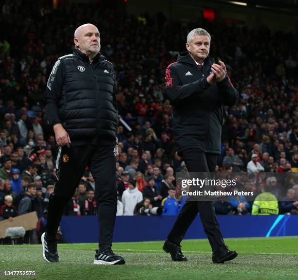 Manager Ole Gunnar Solskjaer and Assistant manager Mike Phelan of Manchester United walk out for the second half during the UEFA Champions League...