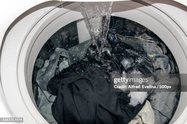 close-up of washing machine - hand wasser stockfoto's en -beelden