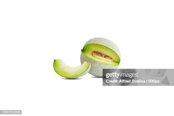 close-up of avocado against white background - カンタロープメロン ストックフォトと画像