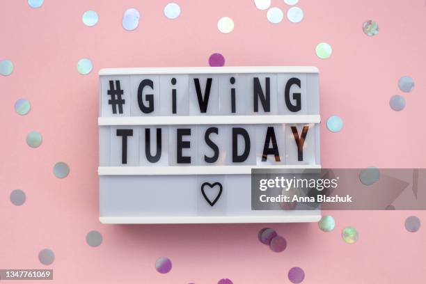 giving tuesday text on lightbox. gift boxes. - giving tuesday stock pictures, royalty-free photos & images