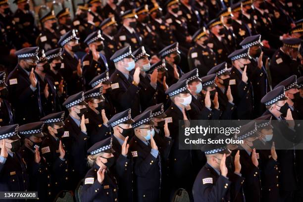New police officers are sworn in at a Chicago Police Department promotion and graduation ceremony on October 20, 2021 in Chicago, Illinois. The city...