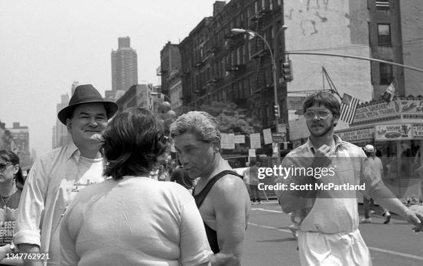 View of a group of people talking on 9th Avenue in Hell's Kitchen during the International Food Festival, New York, New York, May 20, 1989.