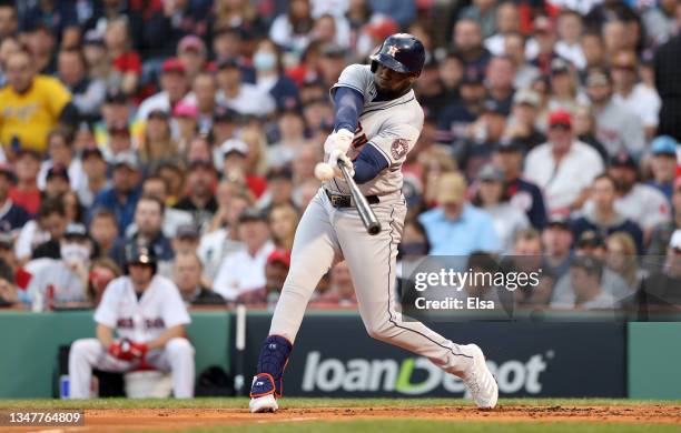 Yordan Alvarez of the Houston Astros hits a home run against the Boston Red Sox in the second inning of Game Five of the American League Championship...