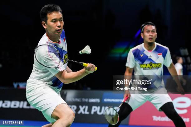 Hendra Setiawan and Mohammad Ahsan of Indonesia compete in the Men's Doubles first round match against Mark Lamsfuss and Marvin Seidel of Germany on...