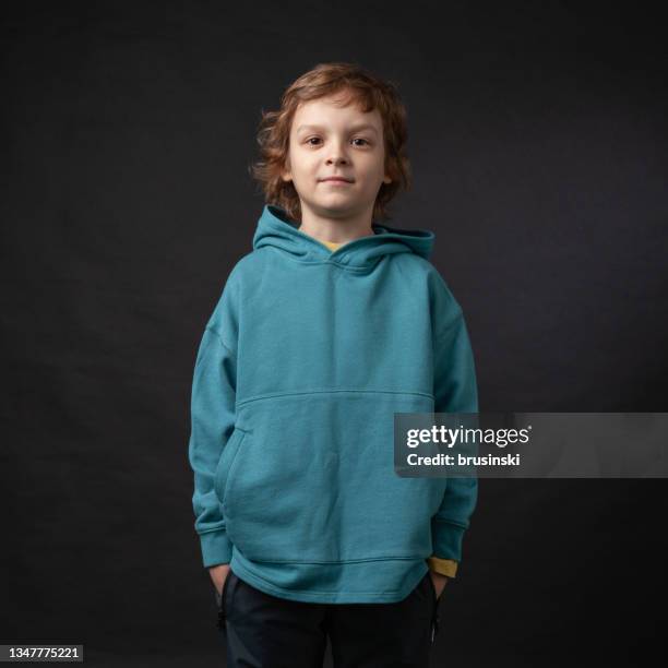 close up studio portrait of 7 year old blond boy with long curly hair - year long stock pictures, royalty-free photos & images