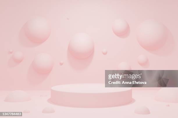 cylindrical pink podium on abstract pastel pink background with many spheres. perfect platform for showing your beauty products. three dimensional illustration - sports round stock-fotos und bilder