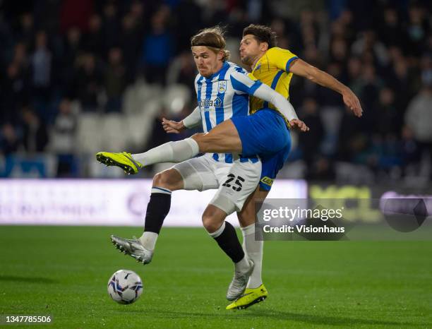 Danny Ward of Huddersfield Town and George Friend of Birmingham City in action during the Sky Bet Championship match between Huddersfield Town and...