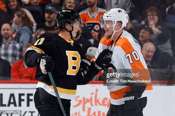 Trent Frederic of the Boston Bruins and Rasmus Ristolainen of the Philadelphia Flyers tangle during the first period at Wells Fargo Center on October...