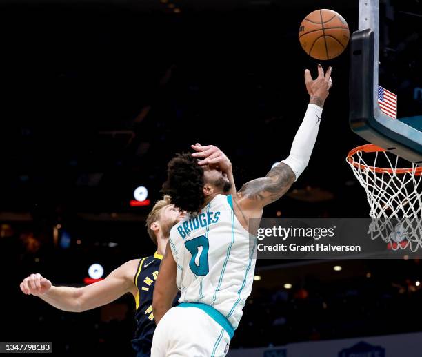 Domantas Sabonis of the Indiana Pacers fouls Miles Bridges of the Charlotte Hornets during the second half of their game at Spectrum Center on...