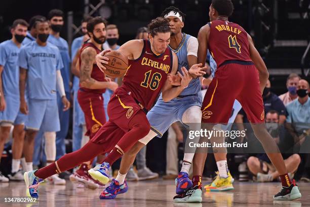 Cedi Osman of the Cleveland Cavaliers handles the ball against Ziaire Williams of the Memphis Grizzlies during the game at FedExForum on October 20,...