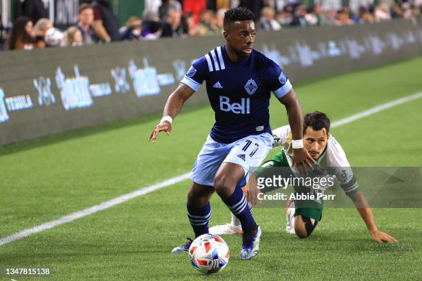 Cristian Dajome of Vancouver Whitecaps controls the ball against Sebastian Blanco of Portland Timbers during the second half at Providence Park on...