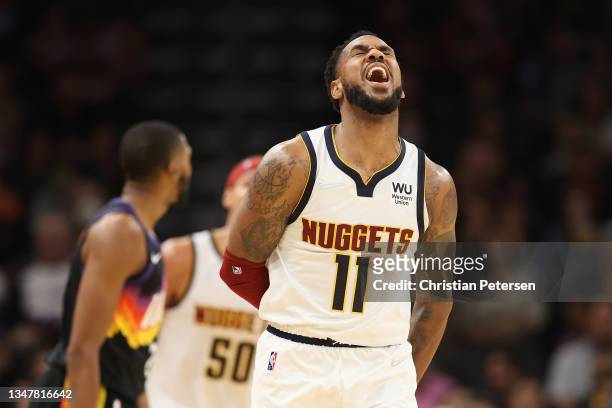 Monte Morris of the Denver Nuggets reacts after a three-point shot against the Phoenix Suns during the second half of the NBA game at Footprint...