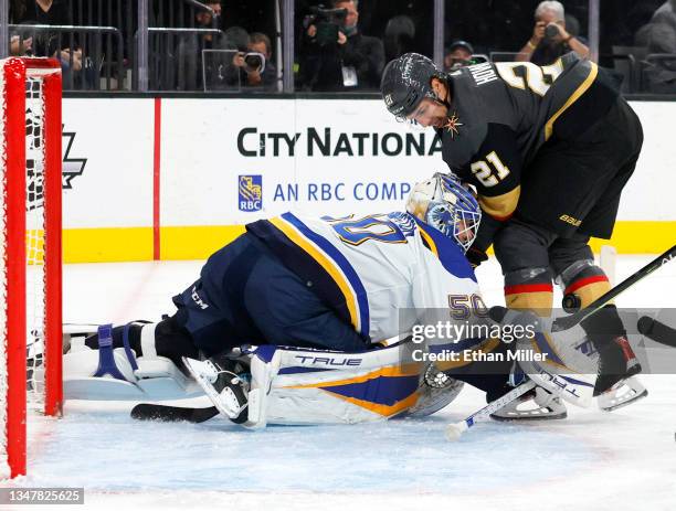 Jordan Binnington of the St. Louis Blues makes a save against Brett Howden of the Vegas Golden Knights in the second period of their game at T-Mobile...