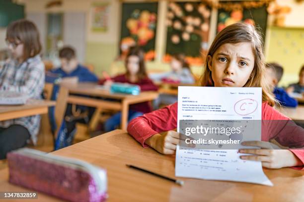 i've got a c minus on my exam! - child report card stock pictures, royalty-free photos & images