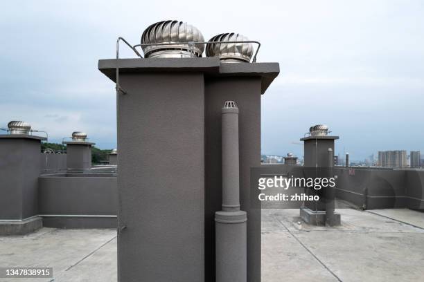 chimney on the roof of a modern building - upper_house stock-fotos und bilder