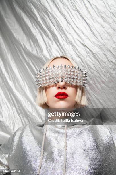 fashionable woman in gray silver outfit with silver background - sunglasses disguise stock pictures, royalty-free photos & images