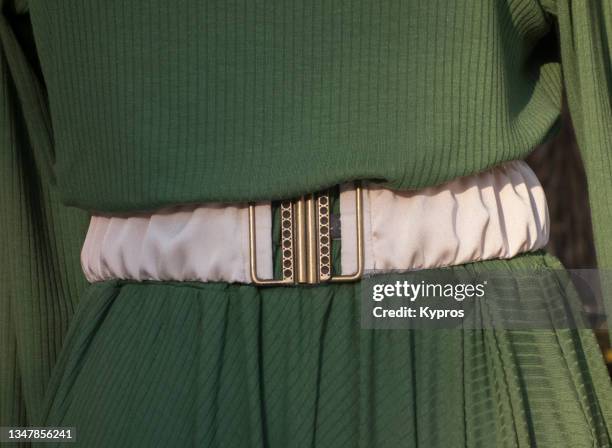 woman wearing belt with dress - buckle stock-fotos und bilder