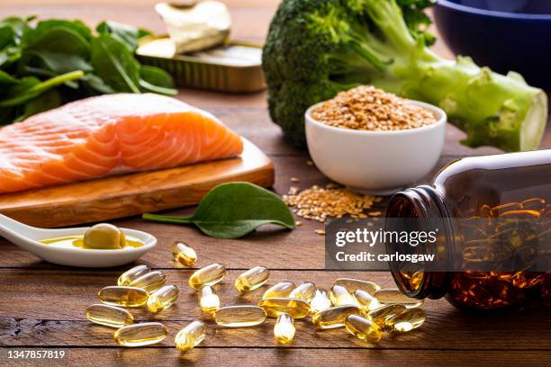 fish oil capsules and diet rich in omega-3 - antioxidant stock pictures, royalty-free photos & images