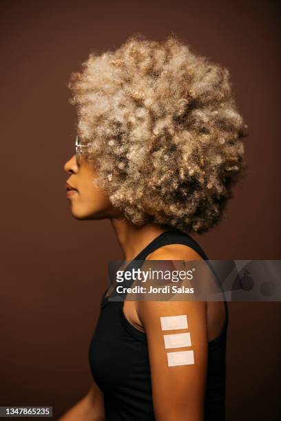 woman with band-aid after vaccination - name patch stock pictures, royalty-free photos & images