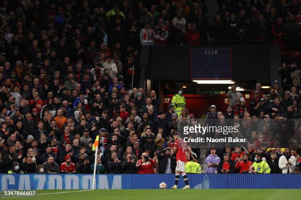 Bruno Fernandes of Manchester United takes a corner kick with on looking crowds in a full stand of fans during the UEFA Champions League group F...