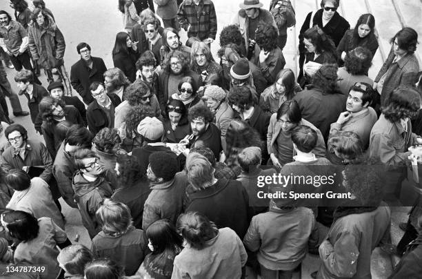 Yippie Jerry Rubin and fans on steps of Harvard's Weidner Library, Cambridge, Massachusetts, 1970.