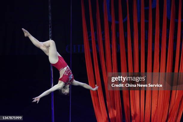 Dancer competes during the 9th Chinese National Pole Dance Championship on October 20, 2021 in Tianjin, China. The championship took place in Tianjin...