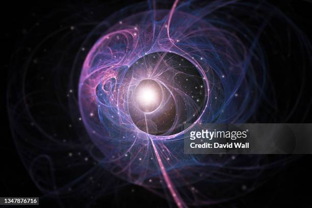 a science fiction concept of an quantum like design. with a glowing centre and stars floating on a black background. - quantum physics stock pictures, royalty-free photos & images