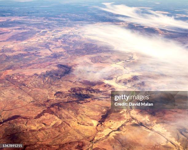 arial image of an arid karoo landscape with some cloud cover. - arial desert stock-fotos und bilder