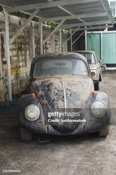 front view of old grunged vw beetle oldtimer - vw beetle stock pictures, royalty-free photos & images