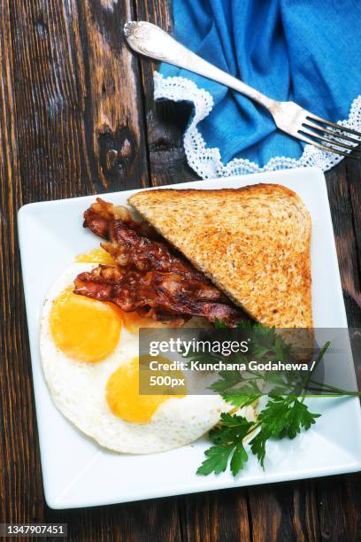 close-up of breakfast served on table - full english breakfast stock pictures, royalty-free photos & images