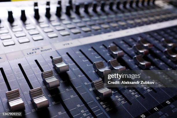 amplifying equipment, studio audio mixer knobs and faders. workplace and equipment of the sound engineer. acoustic mixing of music, selective focus. - radio hardware audio stock pictures, royalty-free photos & images