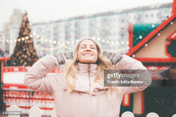 beautiful young woman enjoying christmas time - christmas cute stock pictures, royalty-free photos & images