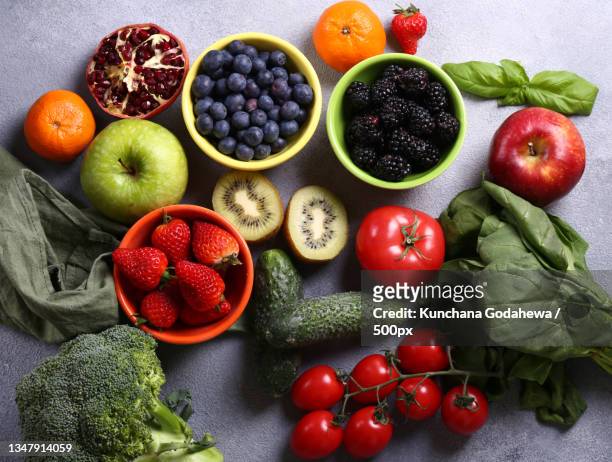 high angle view of fruits and vegetables on table - kiwi fruta imagens e fotografias de stock