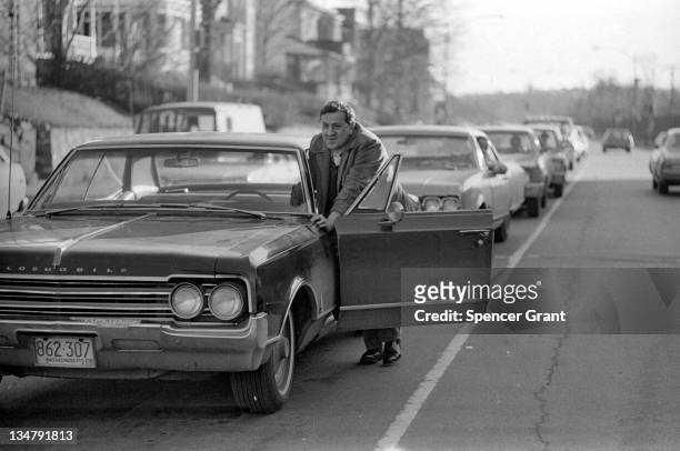 Drivers push cars to a gas station during the oil crisis of 1973-74, Roslindale, Boston, Massachusetts, 1973.