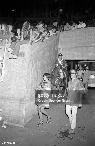 Pregnant Joan Baez arrives to sing at Harvard Stadium, Brighton, Boston, Massachusetts, 1969.