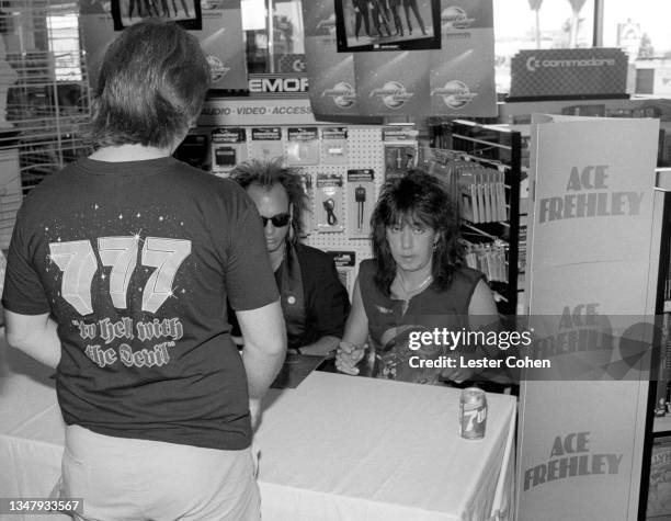 American musician and songwriter Ace Frehley signs autographs for fans circa 1987 in Los Angeles, California.