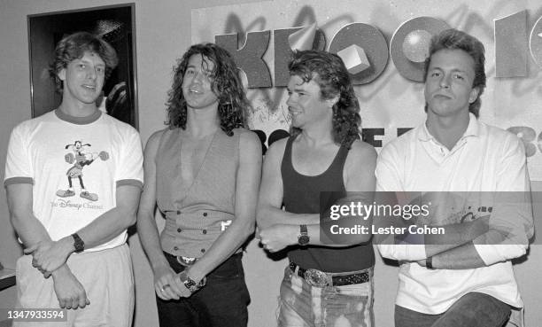 American radio disc jockey Jed The Fish with Michael Hutchence and Tim Farriss of Australian rock band INXS, and KROQ-FM producer John Frost, at the...