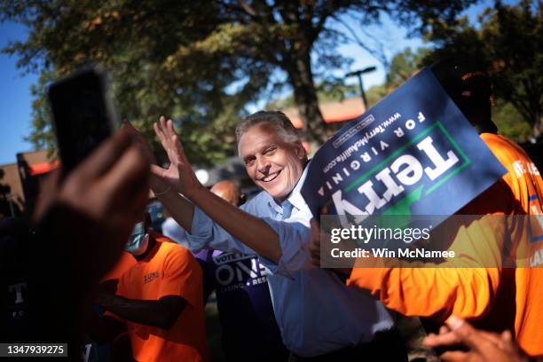 Former Virginia Gov. Terry McAuliffe greets supporters after speaking at a campaign event with current Virginia Gov. Ralph Northam October 21, 2021...