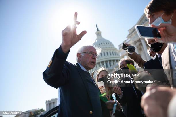 Sen. Bernie Sanders speaks with reporters as he leaves the U.S. Capitol Building following a vote on October 21, 2021 in Washington, DC. According to...