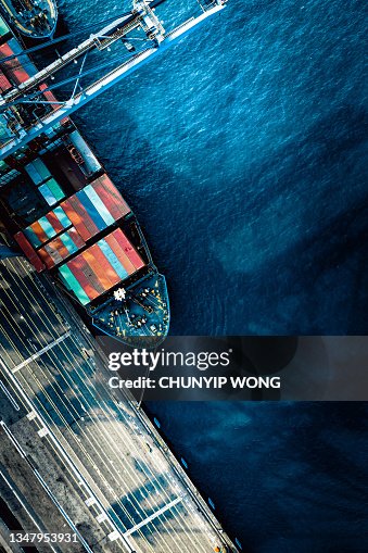 Cranes and shipping containers at the Port of Hong Kong Cranes and shipping containers at the Port of Hong Kong
