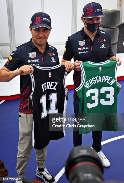 Max Verstappen of Netherlands and Red Bull Racing and Sergio Perez of Mexico and Red Bull Racing pose for a photo after playing basketball on the NBA...
