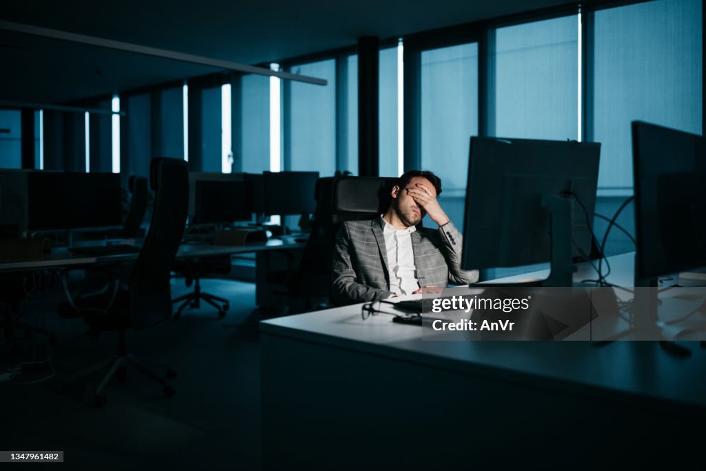 Young businessman tired at night