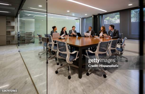 group of executives in a business meeting at the office - mesa redonda imagens e fotografias de stock