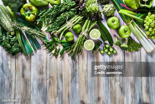 table top view background of a variation green vegetables for detox and alkaline diet. set on a white rustic table with copy space - low carb diet stock pictures, royalty-free photos & images