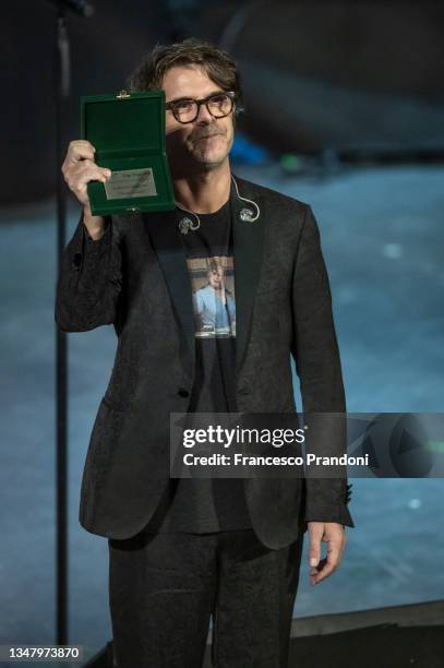 Samuele Bersani Shows Price Targa Tenco during the Premio Tenco at Teatro Ariston on October 21, 2021 in Sanremo, Italy.