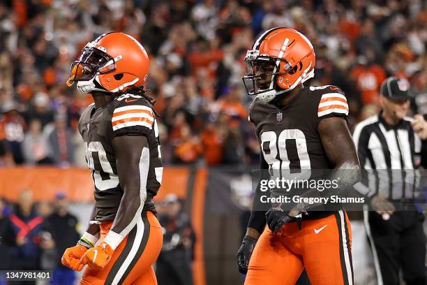 Running back D'Ernest Johnson of the Cleveland Browns celebrates with wide receiver Jarvis Landry after rushing for a first quarter touchdown against...