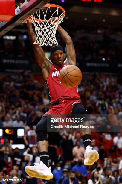 Jimmy Butler of the Miami Heat dunks against the Milwaukee Bucks during the first half at FTX Arena on October 21, 2021 in Miami, Florida. NOTE TO...
