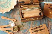 Vintage wooden recipe box trunk with natural recipe cards in rustic kitchen